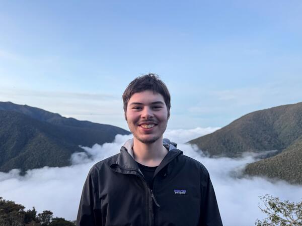a person standing in teh mountains